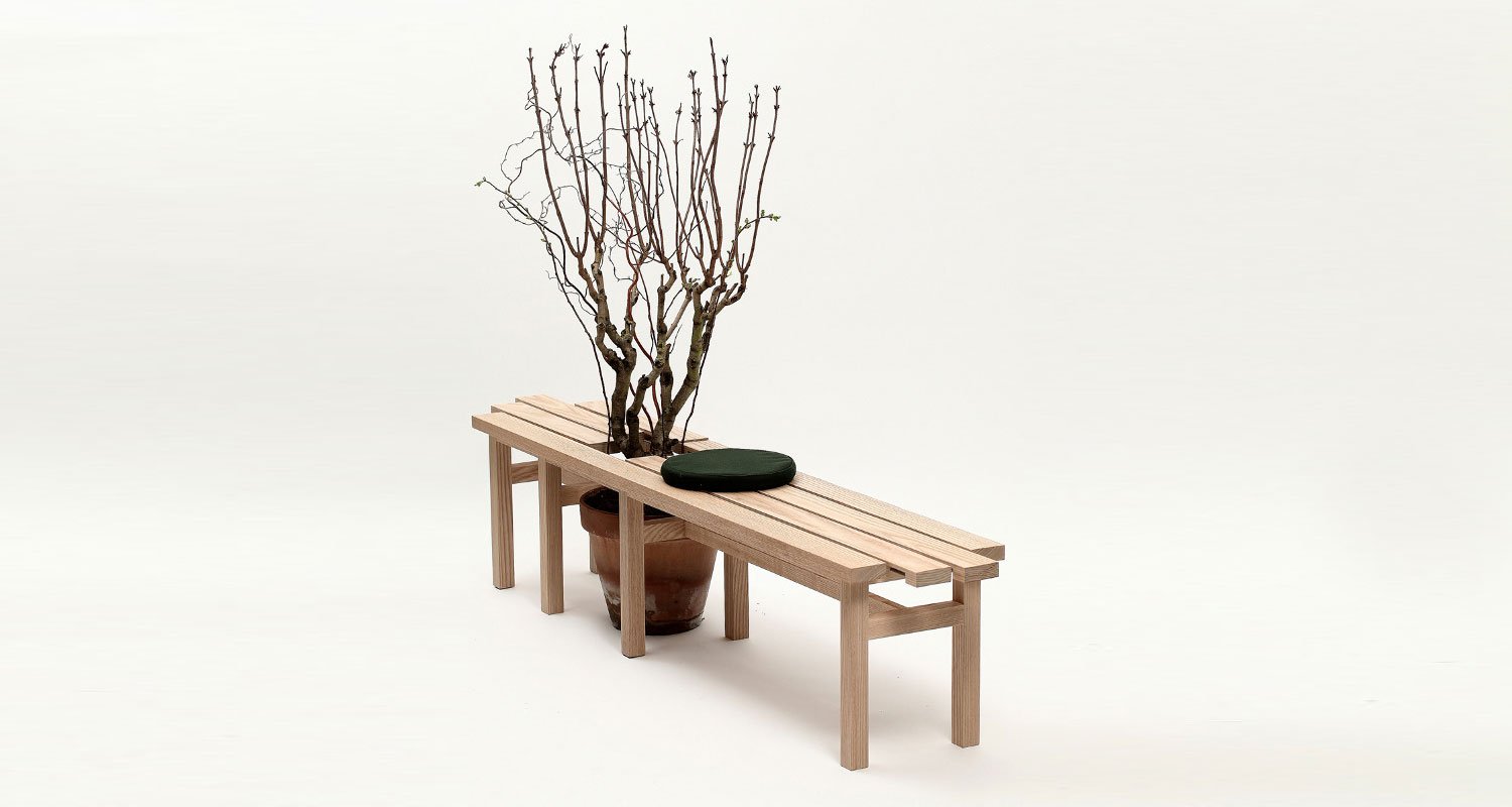 japanese-wooden-bench-with-plants-cushions